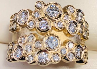 Luxurious gold ring with multiple sparkling diamonds for jewelry lovers.