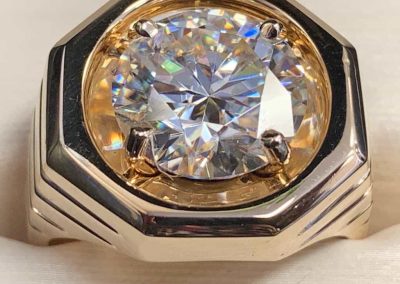 Luxury gold ring with large round diamond for engagement or special occasions.