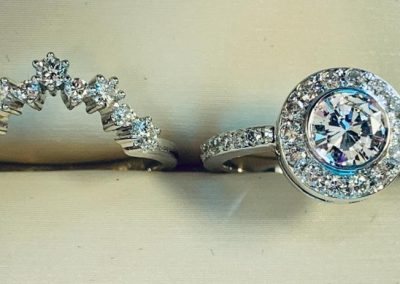 Two stunning diamond rings with intricate designs displayed in Kelowna jewelry shop.