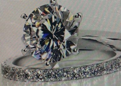 Sparkling diamond ring with a pavé band for special occasions.