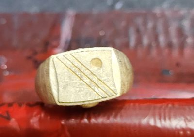 Gold ring with geometric pattern, perfect for jewelry repairs or custom designs in Kelowna.